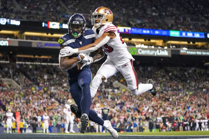 Seattle Seahawks wide receiver D.K. Metcalf (14) catches a touchdown against San Francisco 49ers cornerback Ahkello Witherspoon (23) during the fourth quarter at CenturyLink Field.